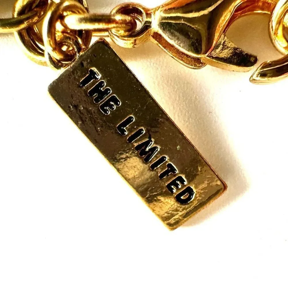 The Limited gold tone and green bracelet